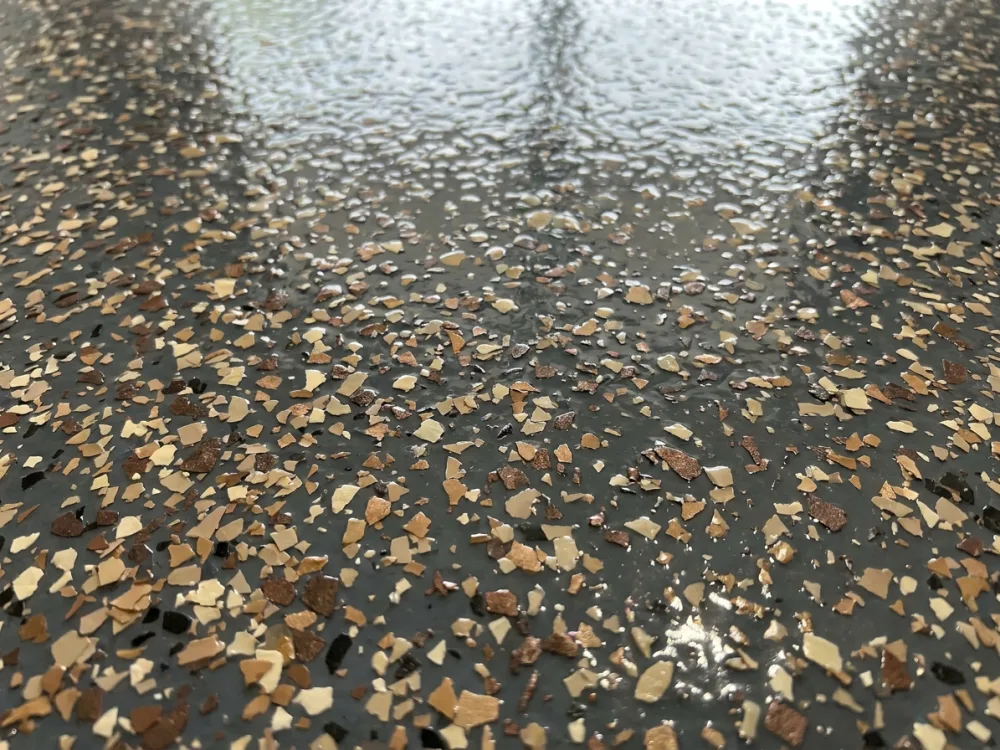Decorative flake detail on a polyaspartic coating